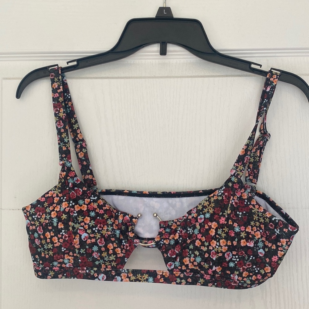 Never worn two piece swim suit. Size L.